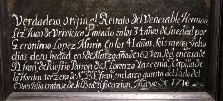 Detalle de la inscripción inferior del retrato de Juan de Briviesca, pintado por Jerónimo López Polanco, con texto añadido en 1716